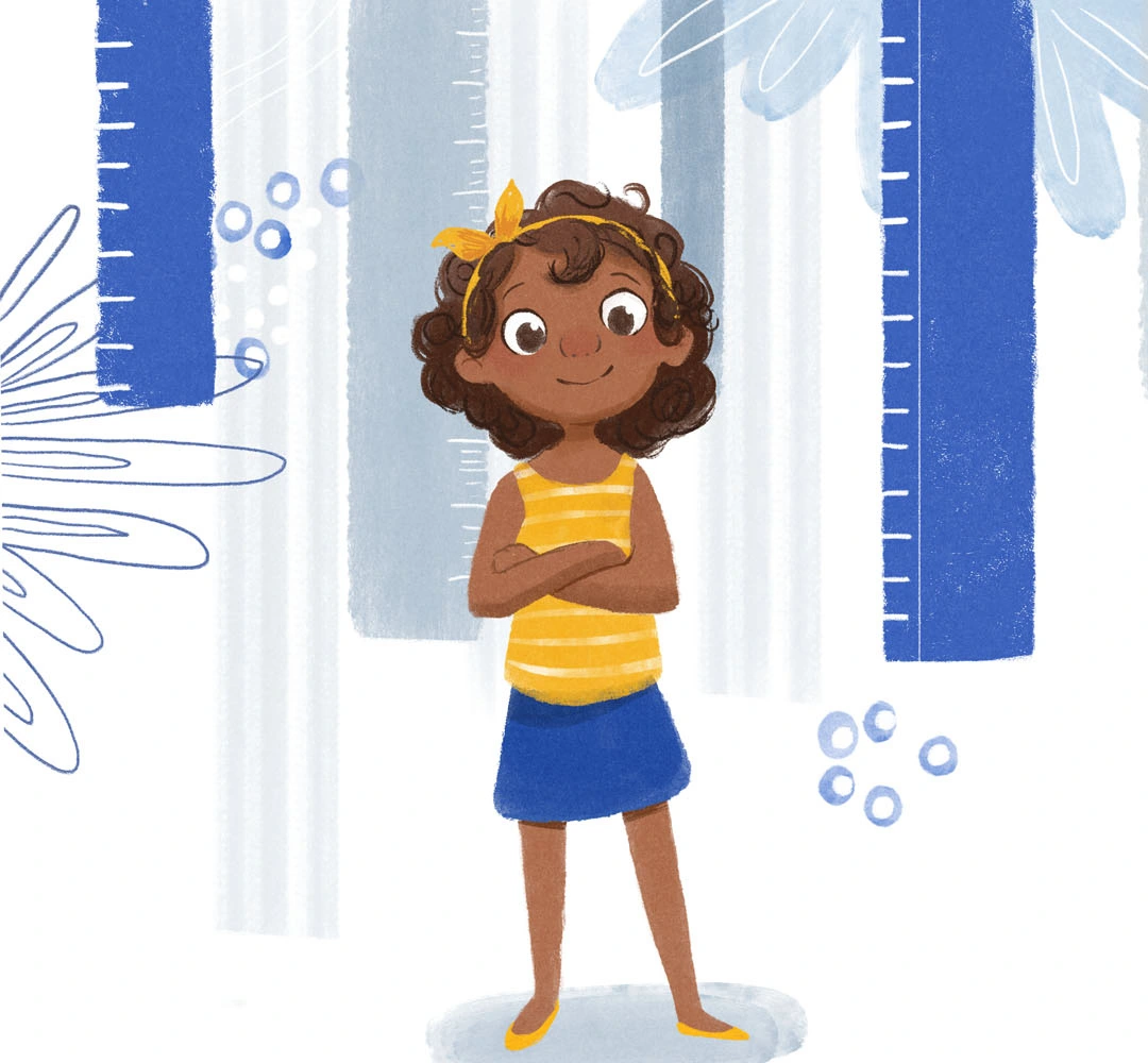 Girl in a striped yellow top standing confidently with her arms folded
